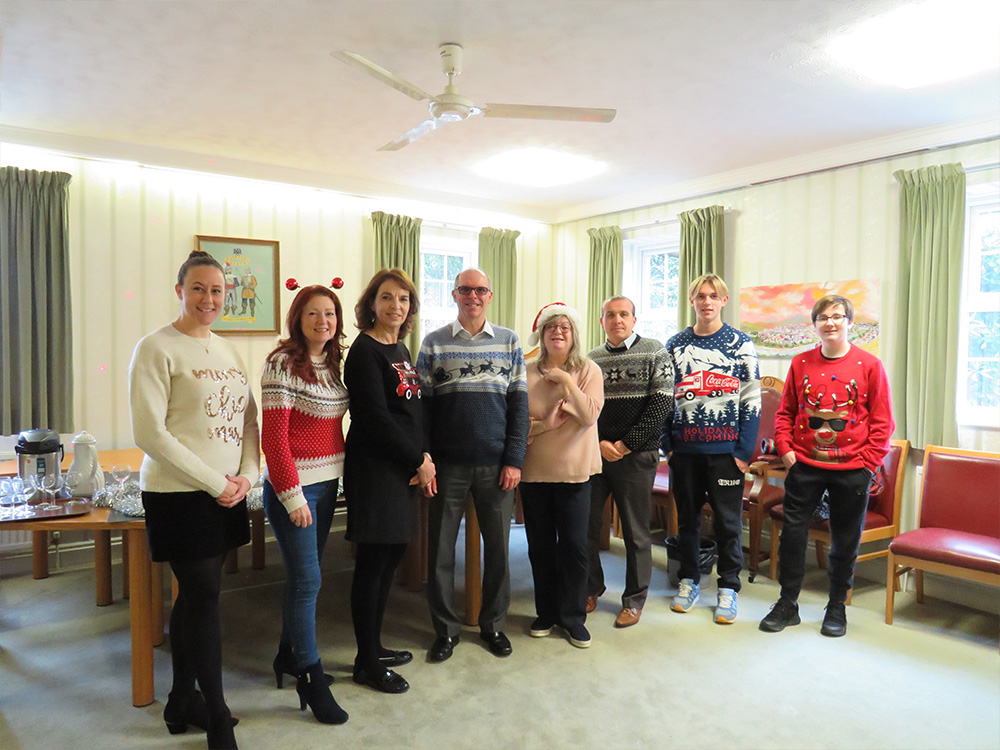 staff in festive jumpers